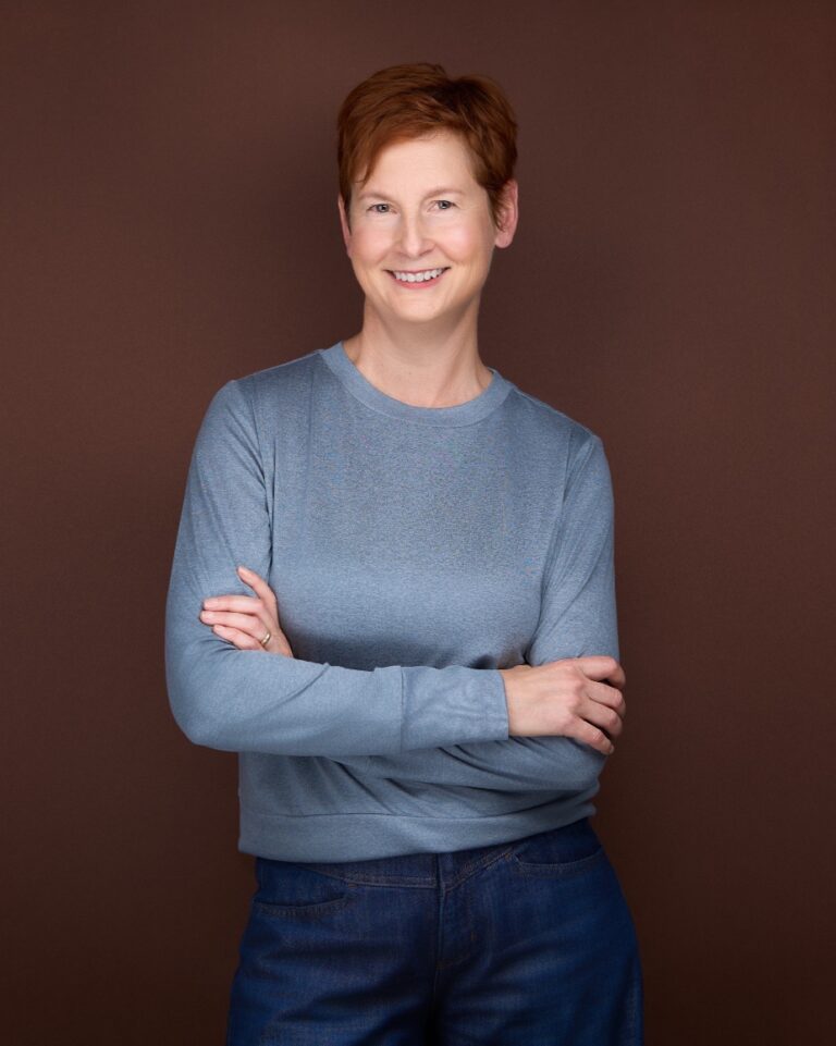 standing profile arms crossed resized